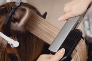Hair straighteners in salon for Hair at the Academy in Exeter